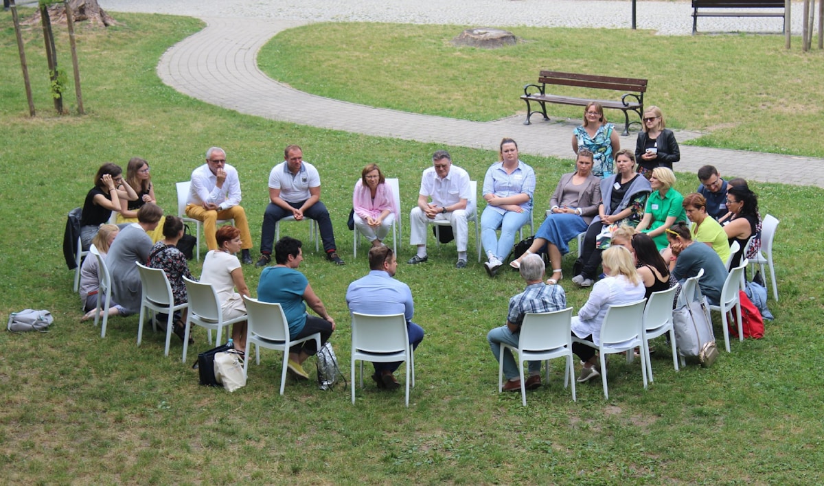 Community members in outdoor planning discussion